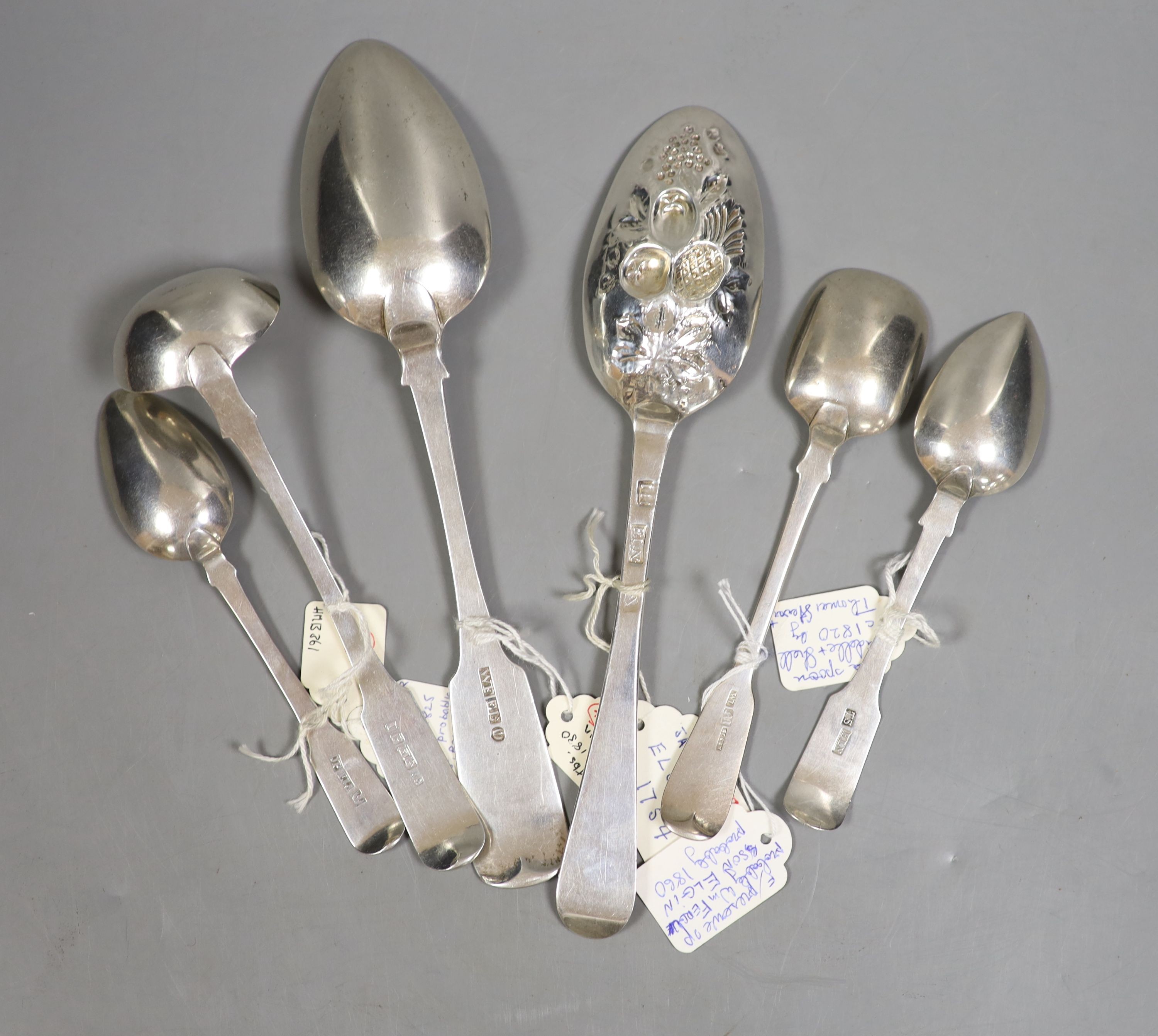 A mid 18th century Scottish provincial silver Hanovarian pattern 'berry' spoon, James Humphrey, Elgin, c.1753, 21.5cm and five other 19th century items of Elgin silver flatware, tablespoon and preserve spoon by William F